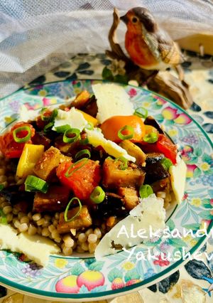 A picture of Warm aubergine salad with giantwholewheat couscous and smoked cheese.
