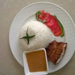 White rice, fish fillet and coconut gravy A picture of White rice, fish fillet and coconut gravy.