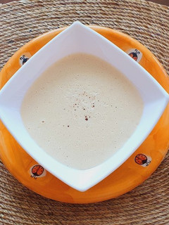 Una foto de Crema de elote con queso brie