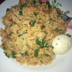A picture of Rice with vegetables.