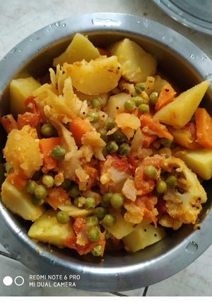 A picture of Aloo kurma curry with vegetables.