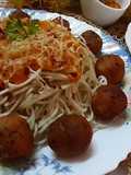 Cheese balls with noodles in tomato sauce