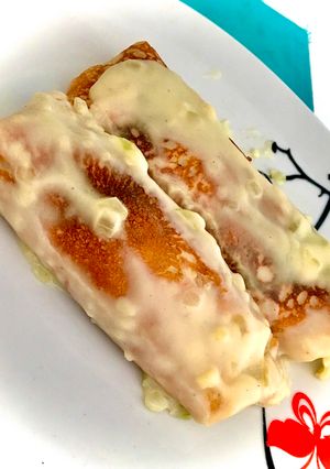 Una foto de Canelones de carne con salsa blanca