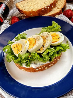 A picture of Homemade oatmeal bread and boiled egg sandwich.