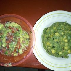 A picture of Mokimo(peas,maize,potatoes and pumpkin leaves) with kachumbari.