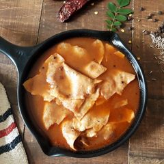 Poricha Appalam Vatha Kuzhambu | Tamarind Curry with Fried Papadam A picture of Poricha Appalam Vatha Kuzhambu | Tamarind Curry with Fried Papadam.