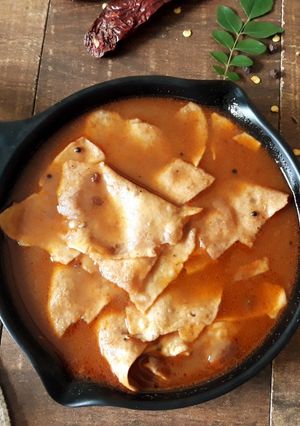 A picture of Poricha Appalam Vatha Kuzhambu | Tamarind Curry with Fried Papadam.