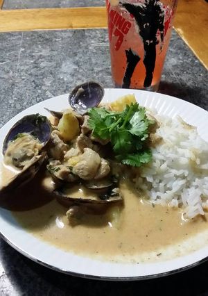A picture of Brad's pork and steamer clams in red Thai curry.