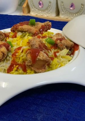 A picture of Arabian rice with popcorn chicken.
