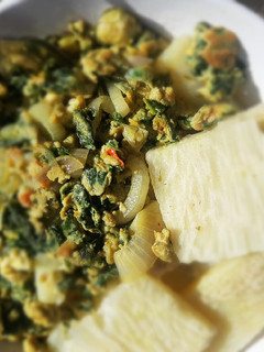 A picture of Boiled yam with spinach fried egg.