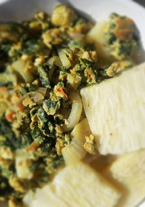 A picture of Boiled yam with spinach fried egg.