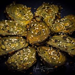 A picture of Patra | Spicy Colocassia leaves layered and steamed.
