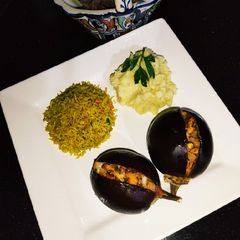 A picture of Baked Eggplant 🍆 with Chicken Fried Rice 🍚.