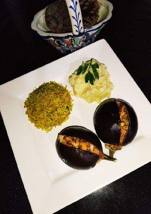 A picture of Baked Eggplant 🍆 with Chicken Fried Rice 🍚.