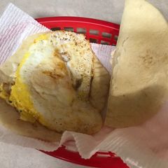 A picture of Daddies too early in the morning fried egg wraps.