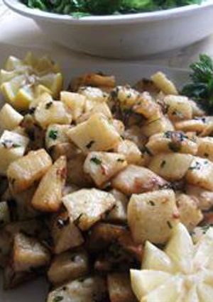 A picture of Potato cubes with cilantro and garlic - batata harra.