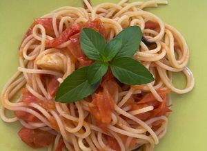 Una foto de Spaghetti con tomate cherry
