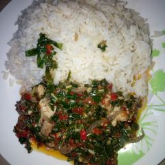 A picture of White rice with vegetables sauce.