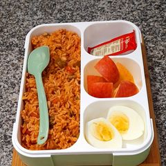 A picture of Veg Biryani With Boiled Egg.
