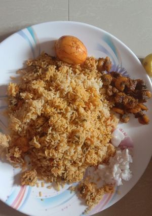 A picture of Prawn briyani and spicy prawn fry.