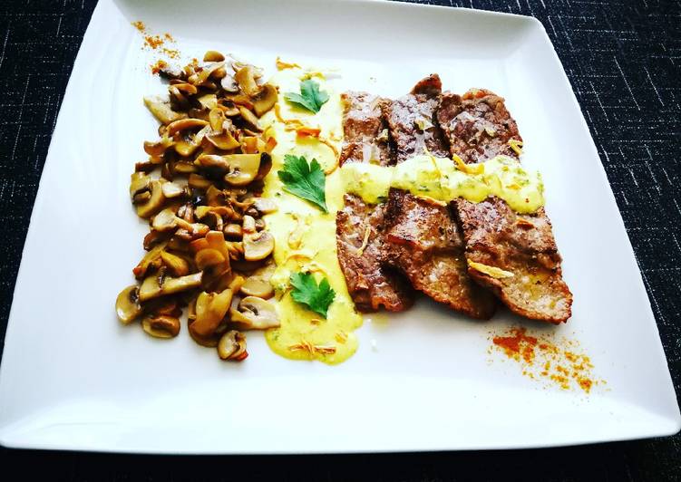 Bistec de ternera con champiñones y salsa verde al curry