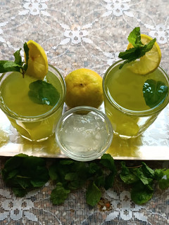 A picture of AloeVera, mint and lemon juice.