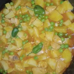 Aloo matar chicken gravy A picture of Aloo matar chicken gravy.