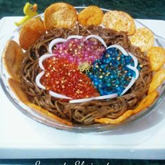 A picture of Sabutdana chat in noodles nest.
