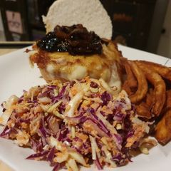 A picture of Mozzrella Burger with Caramelized Onions and Mushrooms.