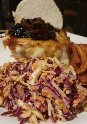 A picture of Mozzrella Burger with Caramelized Onions and Mushrooms.