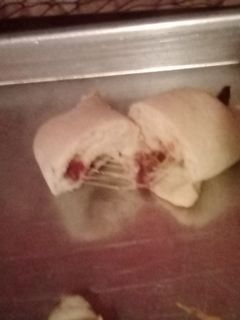 A picture of Cheese and bacon 🥓 cresant rolls.