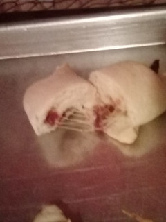 A picture of Cheese and bacon 🥓 cresant rolls.