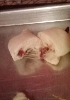 A picture of Cheese and bacon 🥓 cresant rolls.