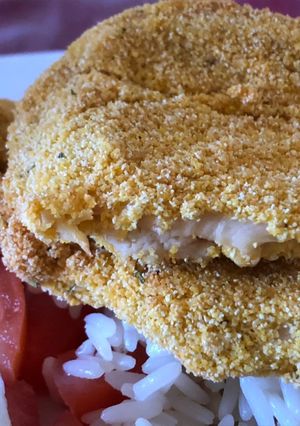 Una foto de Milanesas rebozadas en polenta