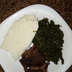 A picture of Ugali, sufuria grilled beef and green#author marathon.