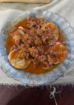 Una foto de Sorrentinos con salsa