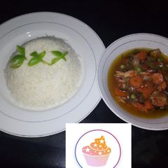 A picture of Rice with fish and vegetable soup.