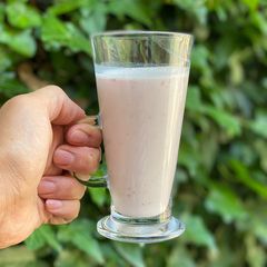 A picture of Strawberry banana smoothie using a hand blender.