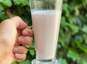 A picture of Strawberry banana smoothie using a hand blender.