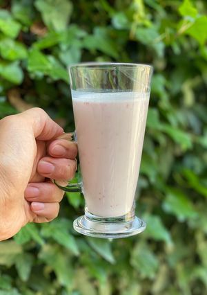 A picture of Strawberry banana smoothie using a hand blender.