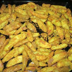 A picture of SPICY OVEN BAKED POTATO WEDGES | Crispy Potato Wedges.