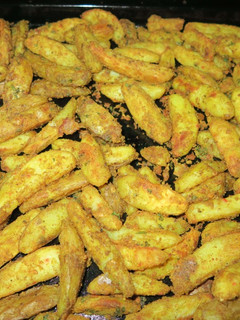 A picture of SPICY OVEN BAKED POTATO WEDGES | Crispy Potato Wedges.