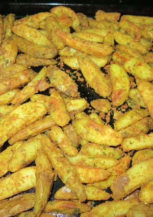 A picture of SPICY OVEN BAKED POTATO WEDGES | Crispy Potato Wedges.