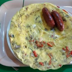 A picture of Fried eggs with sausages.