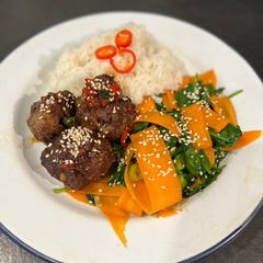 A picture of Sticky hoisin beef meatballs with sesame veg.