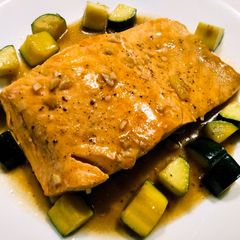 A picture of Salmon and zucchini braised in oyster sauce.
