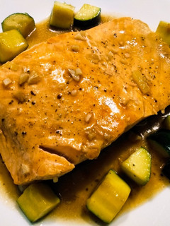 A picture of Salmon and zucchini braised in oyster sauce.