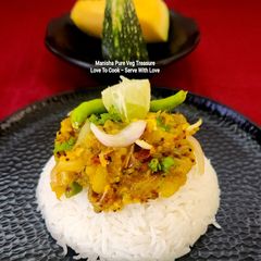 Kumro Bhorta With Bhaat (Bengali Staple Food) Pumpkin Bharta With Plain Steamed Rice A picture of Kumro Bhorta With Bhaat (Bengali Staple Food) Pumpkin Bharta With Plain Steamed Rice.