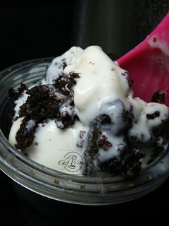 A picture of Vanilla Ice cream with Moist chocolate cake.
