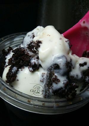 A picture of Vanilla Ice cream with Moist chocolate cake.